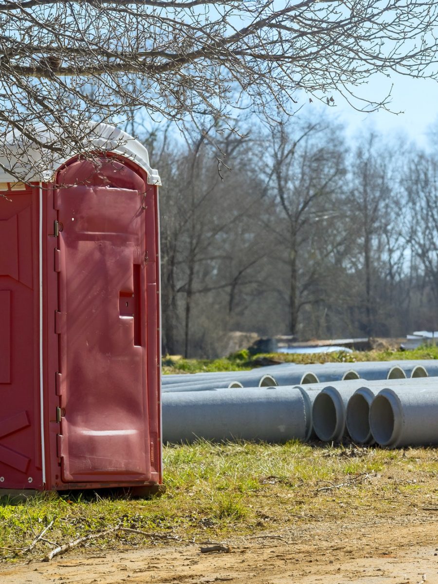 Mobile portable outdoor restroom toilet is at a construction site